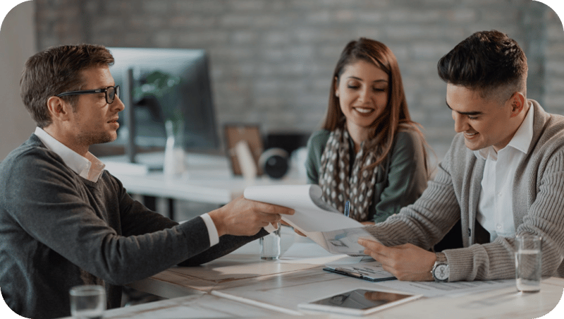 happy-couple-signing-contract-meeting-with-their-real-estate-agent-office 1